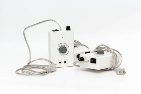 Power plug and Power outlet, isolated on power cord cable unplugged with White background, closeupの写真素材