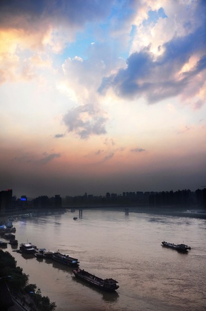 The Yangtze river in Chongqing city, with dusk shot and boatの写真素材