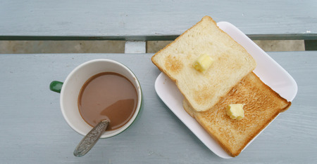 Bread Toast with Cocoa Drink on the gray wooden table.の写真素材