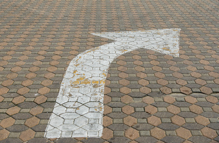 White Arrow on block streetの写真素材