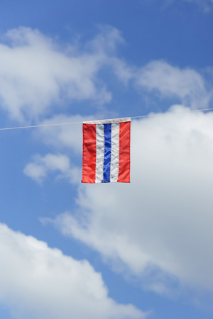 Thailand flag with blue sky backgroundの写真素材