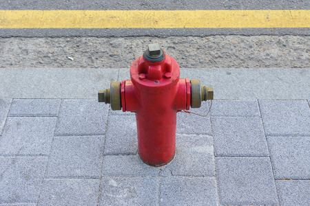 Red fire hydrant water pipe near the road.の写真素材