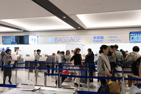 SAPPORO - JAPAN - APRIL 2 2018 - The people queueing to load baggage at New Chitose Airport Hokkaido, Japan on April 2, 2018.のeditorial素材