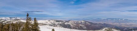 Parnoramaticka photo of winter landscape in the mountains with beautiful sky, Poland Beskids