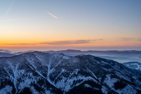 Sunrise on ridge in snowy mountains, Slovakia Low Tatras, dumbier