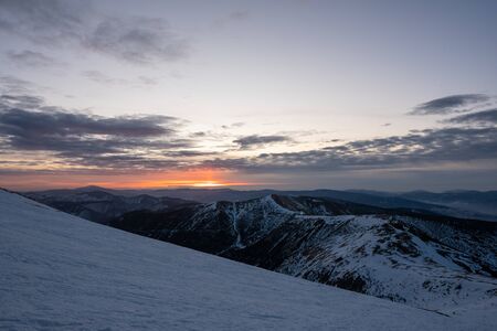 Blue hour before sunrise in snowy mountains, Slovakia Low Tatras, dumbier