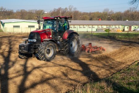 tractor working on the harvest field, czechの写真素材