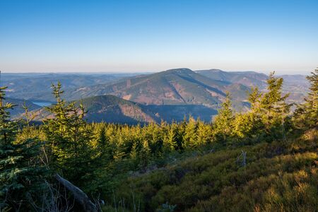 Beautiful view of mountains covered with spruces and dam in valley, Czech Beskydy lysa horaの写真素材