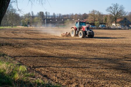 tractor working on the harvest field, czechの写真素材