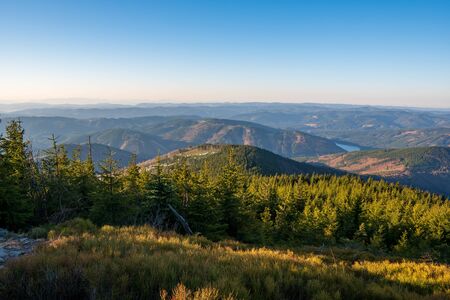 Beautiful view of mountains covered with spruces and dam in valley, Czech Beskydy lysa horaの写真素材