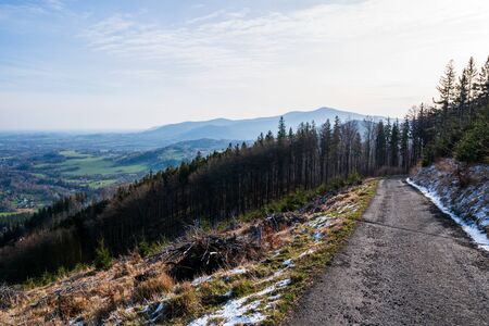 view of the valley and Lysá hora and the field in spring, czech beskydy Celadnaの写真素材