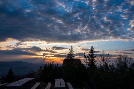 cottage on top of the mountain at sunrise in Beskydy Javorovy vrch, czech 13.4.2020の写真素材