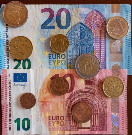 banknotes and coins of European currency Euro, Eur 10 20