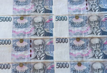 5000 CZK banknotes stacked on the table next to each otherの写真素材