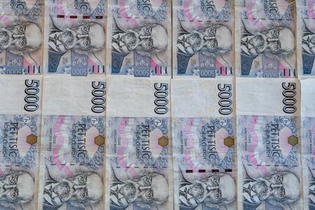5000 CZK banknotes stacked on the table next to each otherの写真素材