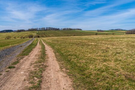 pasture in a mountain area in spring with blue skyの写真素材