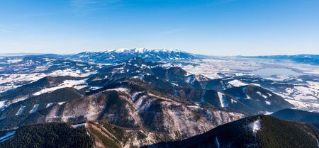 High Tatras mountains snowy in winter with beautiful hills below them, Slovakia Velky Choc 12.1.2020の写真素材