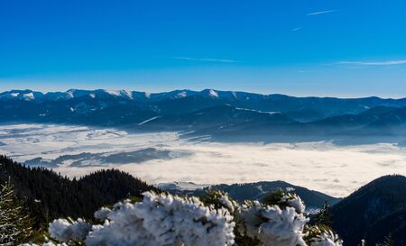 Western Tatras mountains snowy with fog in the valley in winter, Slovakia Velky Choc 12.1.2020の写真素材