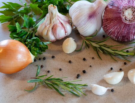 Garlic and onion on the white stone tableの写真素材