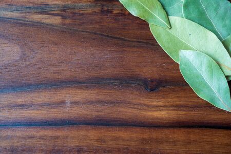 set of Dried bay leaves isolated on woodenの写真素材