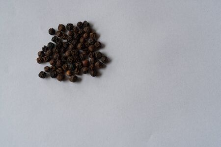 Black pepper was placed on a white backgroundの写真素材