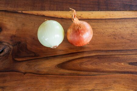 Onion on a old wooden table close upの写真素材