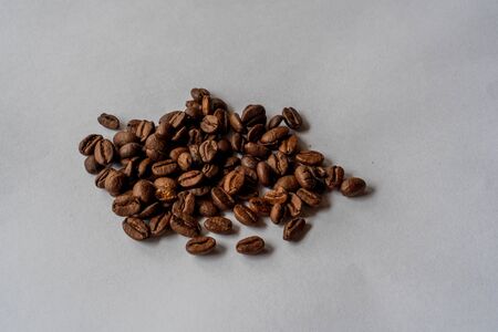 a few grains of coffee on a white backgroundの写真素材