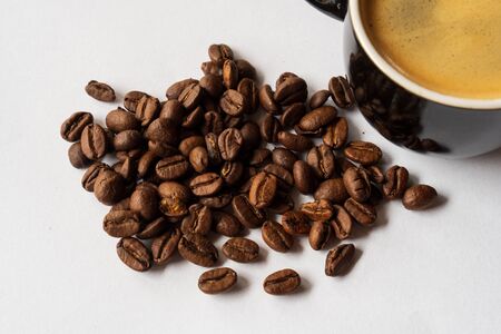 Coffee cup and beans on a white background.の写真素材