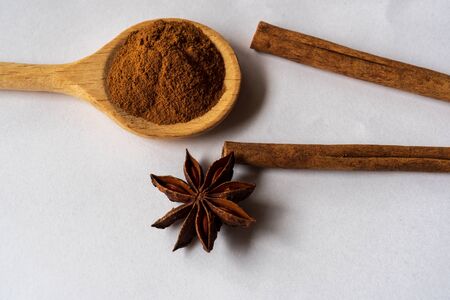 anise star and cinnamon stick isolated on white backgroundの写真素材