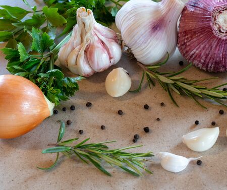 Garlic and onion on the white stone tableの写真素材