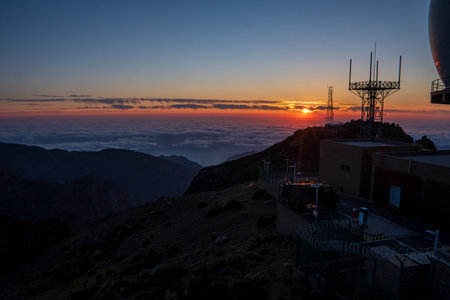 Sunrise in Madeira mountains peaks in sunlight, scenic view over landscape and Pico Ruivo, Portugal.の写真素材