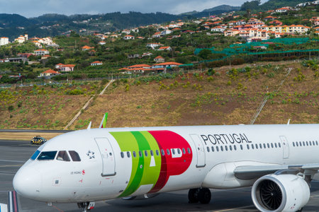 FUNCHAL, PORTUGAL - Nov 13: Passenger plane from Portuguese airline TAP prepares for take off from Funchal Airport on May 10, 2022 at Madeira, Portugalのeditorial素材