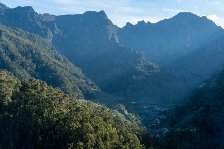 A breathtaking aerial view of the Madeira mountain range, showcasing its lush valleys and trees with tranquil plateaus. Nature at her finest!の写真素材