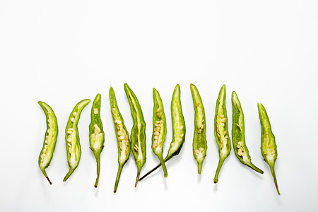 Green Chilli pepper isolated on white backgroundの写真素材