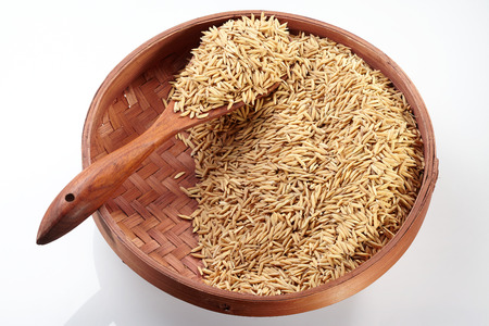 Paddy on Tray  Wood Spoon isolated on white backgroundの写真素材
