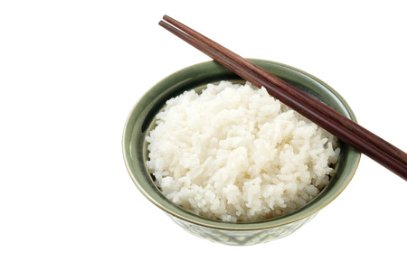 Rice on green Bowl with wood chopsticks isolated on white backgroundの写真素材