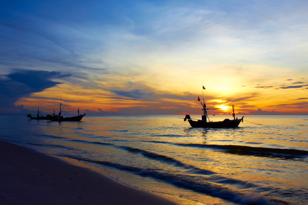 Boat with sea scape in the start of sunrise.の写真素材