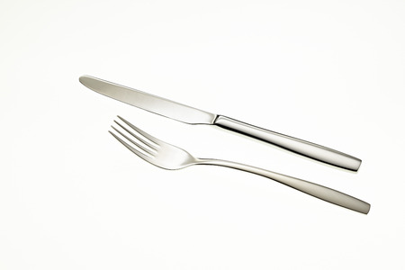 Fork and knife isolated on white backgroundの写真素材