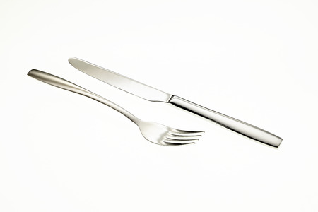 Fork and knife isolated on white backgroundの写真素材