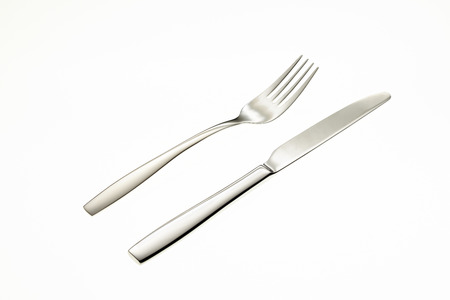 Fork and knife isolated on white backgroundの写真素材
