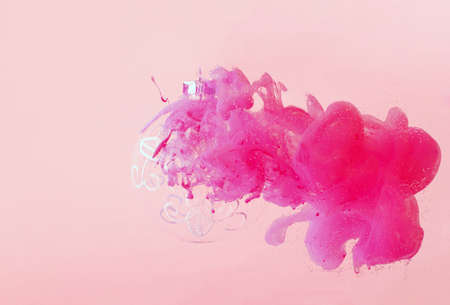Pastel pink aesthetic, glass bauble and paint splash. Creative Christmas decoratingの写真素材