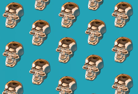 Golden skulls, creative pattern against bright blue background.の写真素材