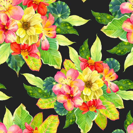 Beautiful bouquet with tropical flowers and plants on black background. Composition with dahlia, lily, begonia, palm and croton leaves.の写真素材