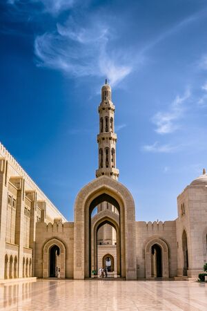 Muscat,Oman-22nd july 2019. Sultan Quaboos Grand Mosque minaret with beautiful clouds and blue sky, Islamic traditional religious architecture and landscape.の写真素材