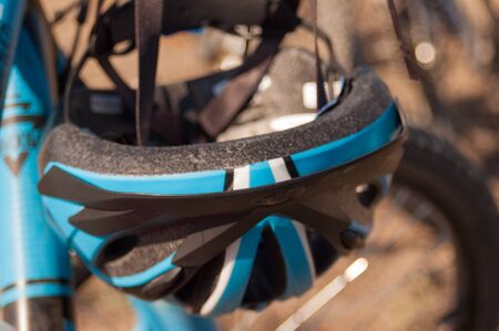 closeup of bicycle hanging helmetの写真素材