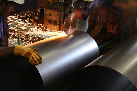 Raw material of Big Oil drums in a factory go downの写真素材