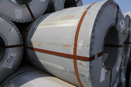 Raw material of Big Oil drums in a factory go downの写真素材