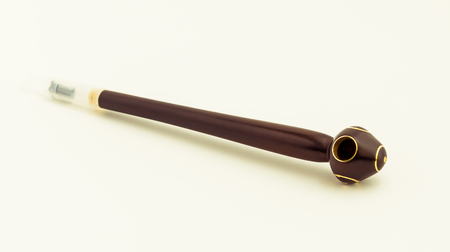 beautiful wooden smoking pipes on white backgroundの写真素材