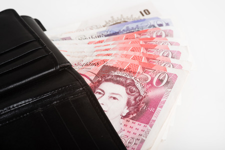 The European currency pounds in a black wallet.の写真素材