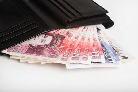 The European currency pounds in a black wallet.の写真素材